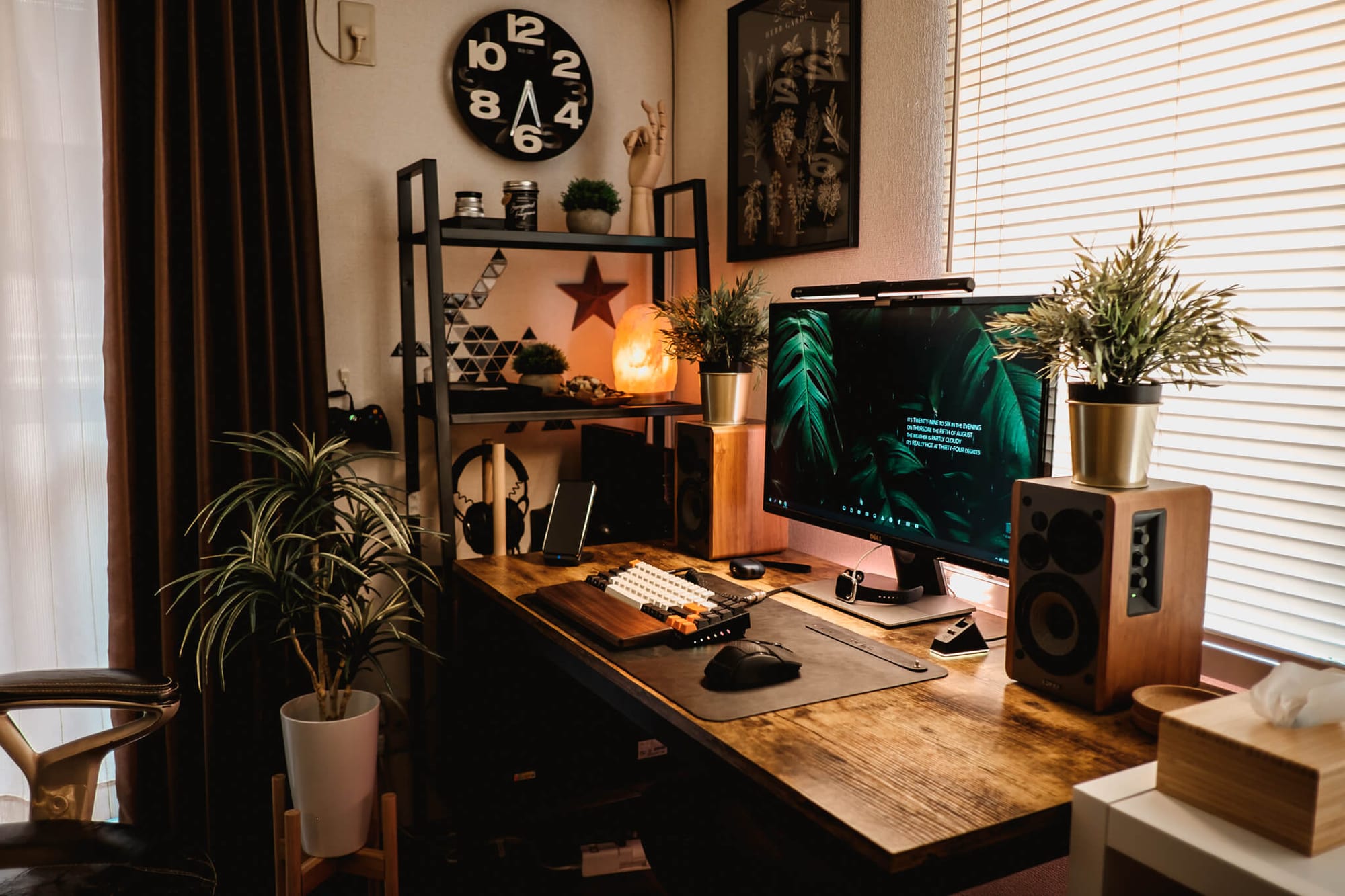 A cosy industrial home office setup with plants