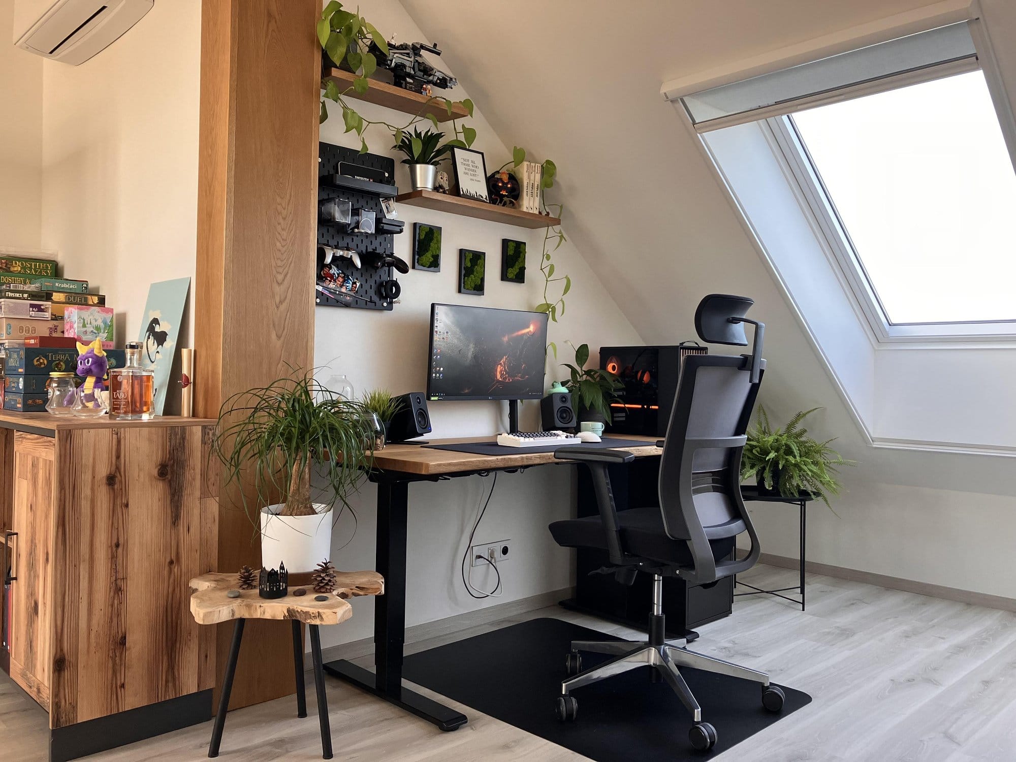 A stylish home office with a wooden desk, ergonomic chair, computer setup, and multiple plants