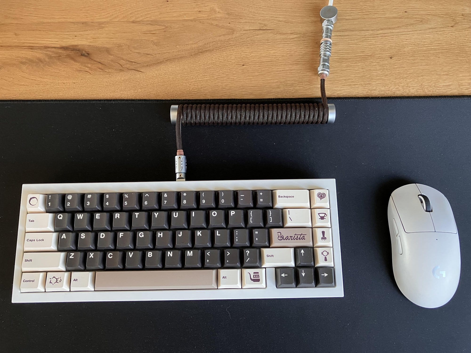 A QK65 mechanical keyboard with Gateron Oil King switches and MW Barista keycaps