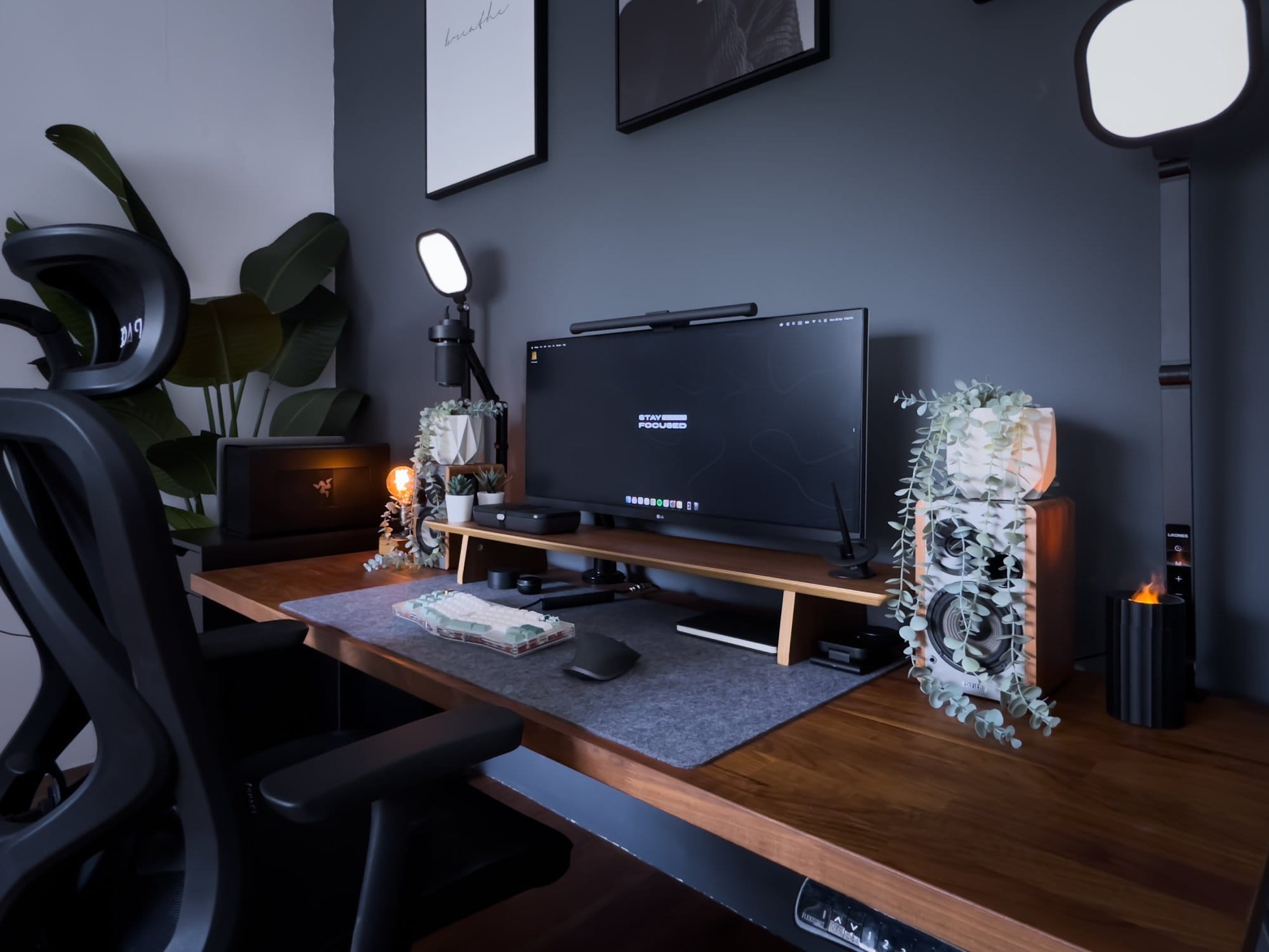 A modern workspace featuring an LG 34WK650 monitor on a Flexispot MA-8 mount, Edifier R1280T speakers, a MacBook Pro 2018 in a Razer Core X eGPU, alongside a SPACE Ergonomic Seat Pro chair