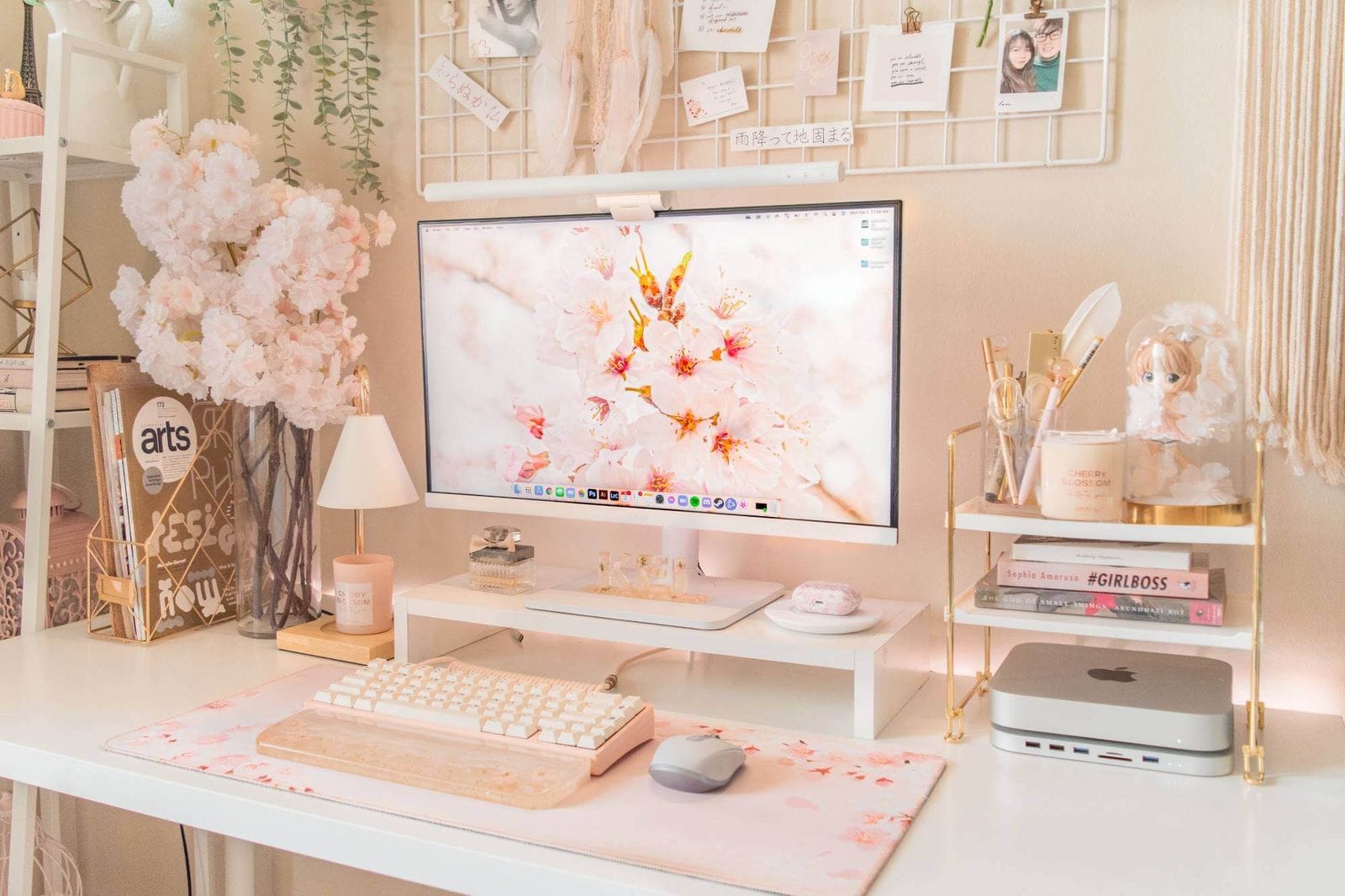 A soft pink desk setup in a home office