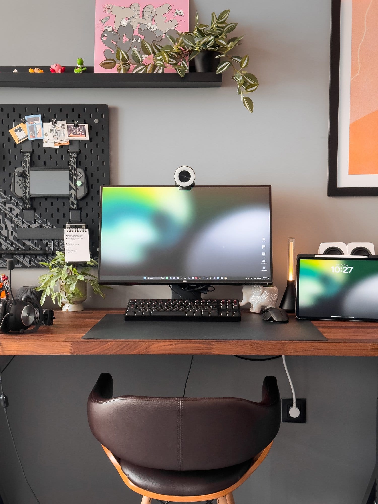 A neatly organised workspace with a Dell monitor and Razer Kiyo webcam, Logitech G Pro keyboard and mouse, an iPad Pro 12.9 (3rd Gen), Logitech G Pro X headphones, and a variety of plants and decorations, all set on a wooden IKEA KARLBY desk with IKEA ALEX drawers and an IKEA UPPSPEL pegboard in the background