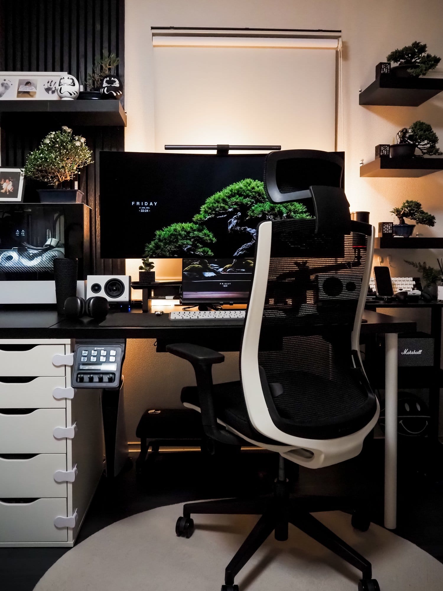 A stylish workspace featuring a Corsair XENEON FLEX 45WQHD240 monitor with a BenQ ScreenBar Halo light bar, a MacBook Pro 13-inch, M1, 2020 laptop, and a white office chair by AIMchair