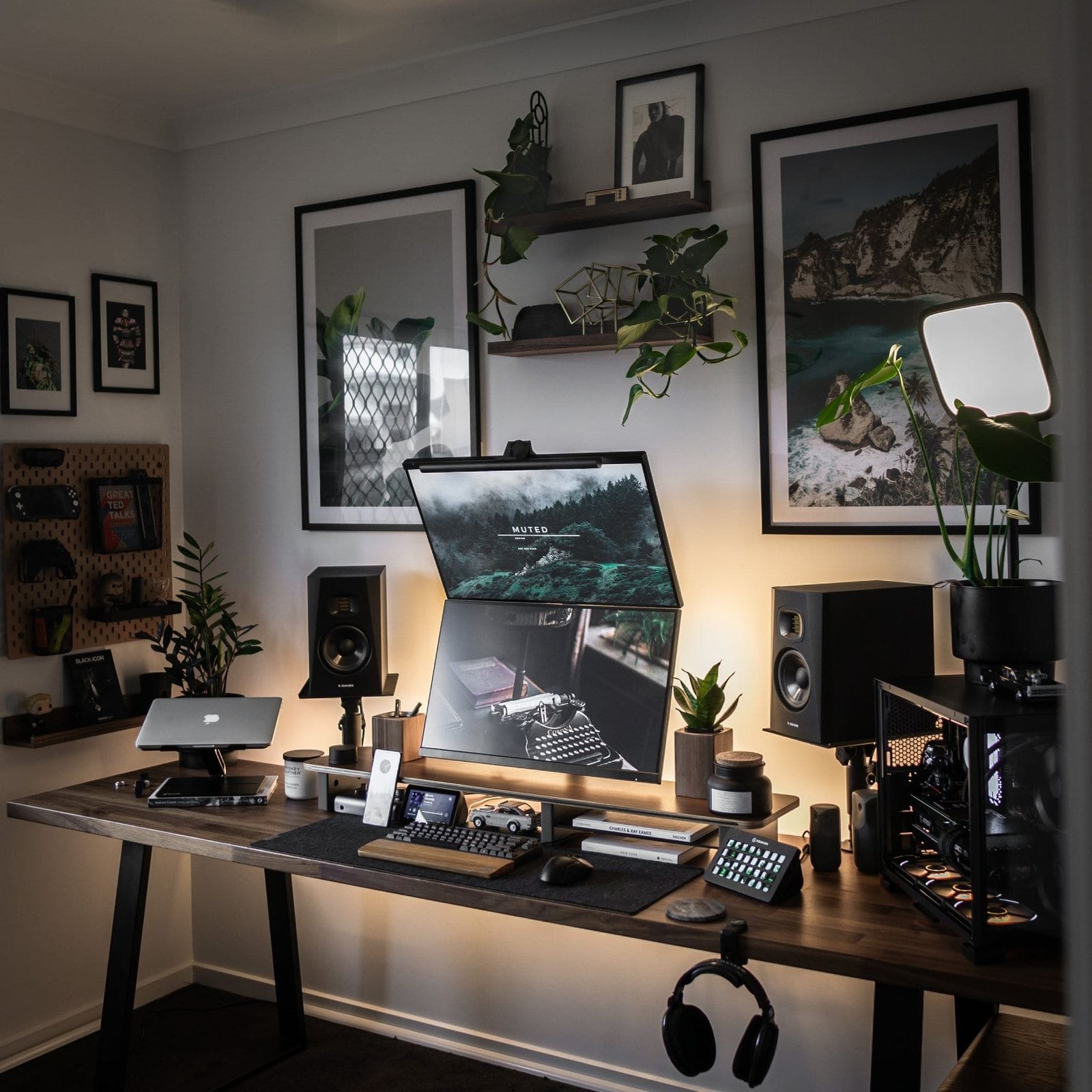 A stylish home workspace featuring an IKEA KARLBY worktop paired with a dark-stained frame, complemented by dual monitors