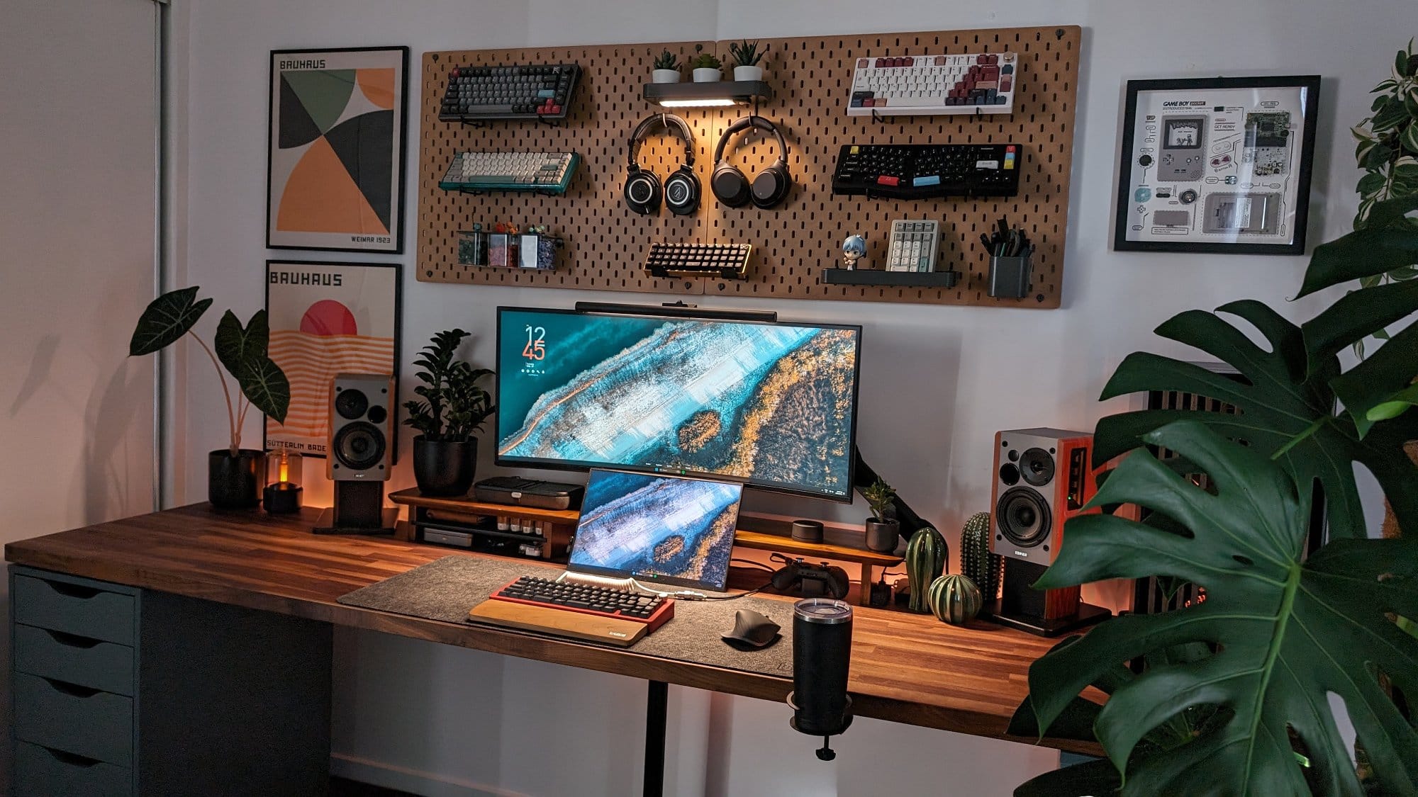 A stylish and well-organised workspace featuring a widescreen Alienware (AW3420DW) monitor, Edifier R1280DB speakers, and a Sugar65 keyboard