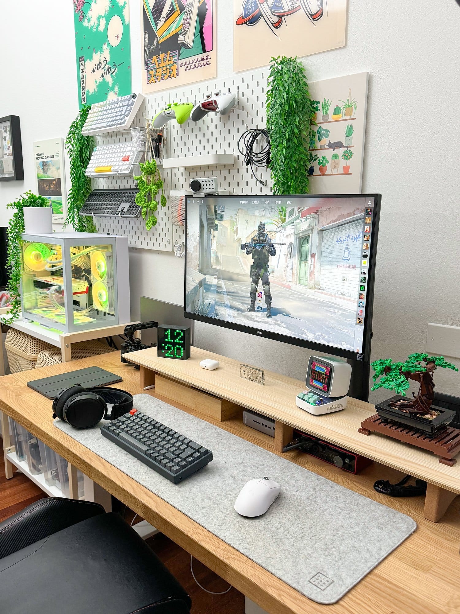 A modern gaming and work setup featuring an LG 27UN880P monitor, NuPhy Halo keyboard, Logitech G Superlight Pro mouse on a Harber London wool-like desk mat, MacBook Pro M1 Pro 2022, and Radeon 7900XTX external GPU, all arranged on an IKEA KARLBY tabletop with Flexispot legs