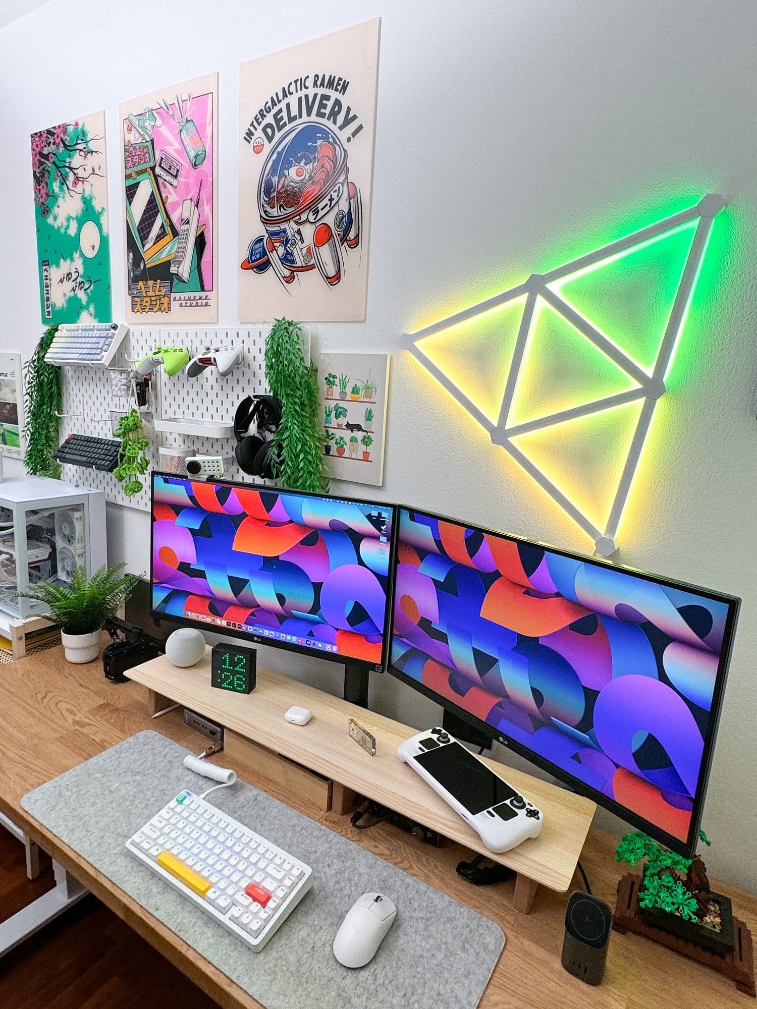 A modern dual-monitor workspace featuring LG 27UN880P monitors, a NuPhy Halo keyboard, Logitech G Superlight Pro mouse on a Harber London wool-like desk mat, a glowing PC setup with Radeon 7900XTX external GPU, and decorative elements including vibrant wall art, green plants, and geometric LED wall lights