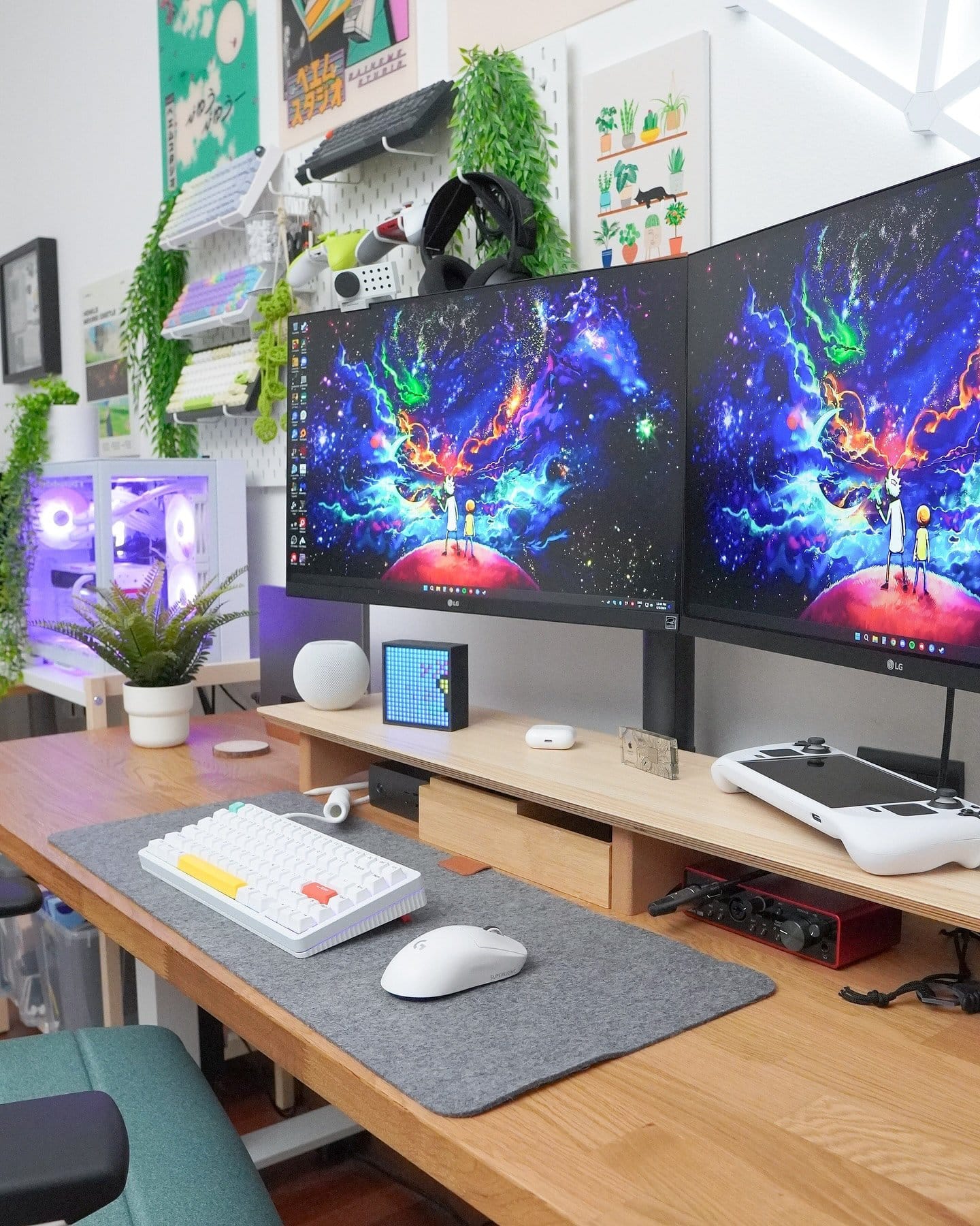 A vibrant and organised home office featuring dual monitors, an IKEA KARLBY worktop, and a mechanical keyboard