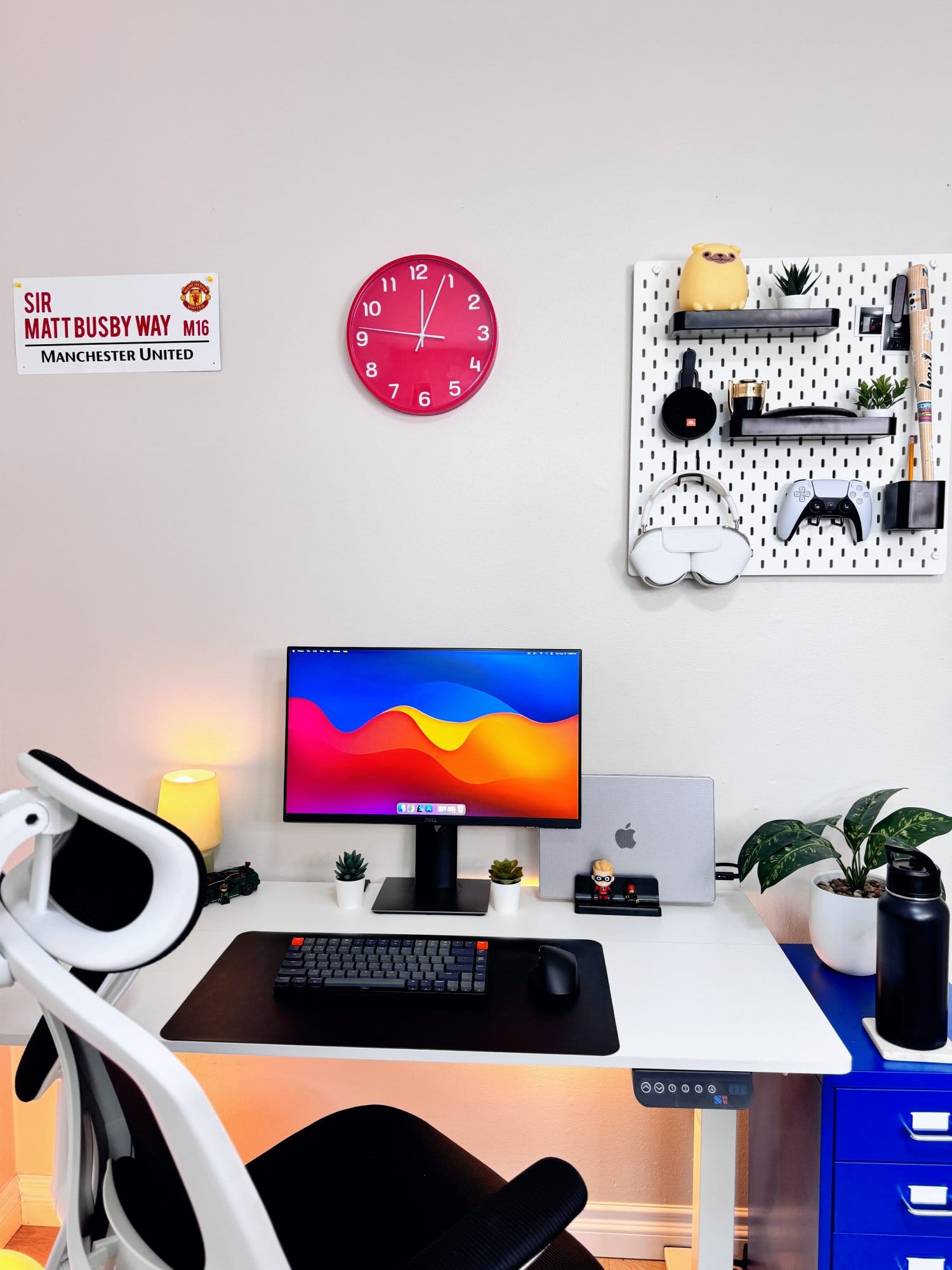  A minimalist desk setup with a Dell P2419H monitor, Keychron K3 wireless mechanical keyboard, and MacBook Pro 2023, set on a SHW adjustable desk with a KERDOM ergonomic chair