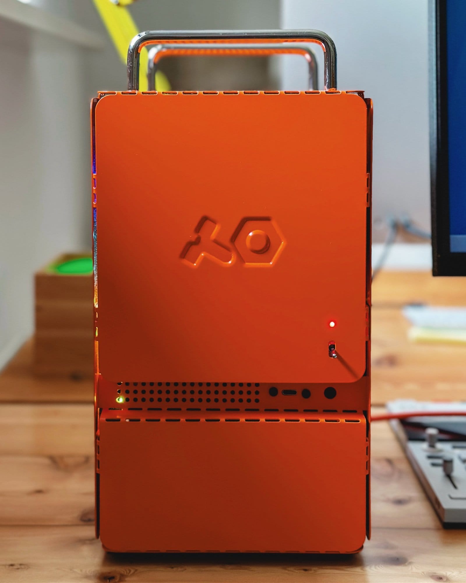 A close-up of a bright orange Computer-1 (TE) PC case