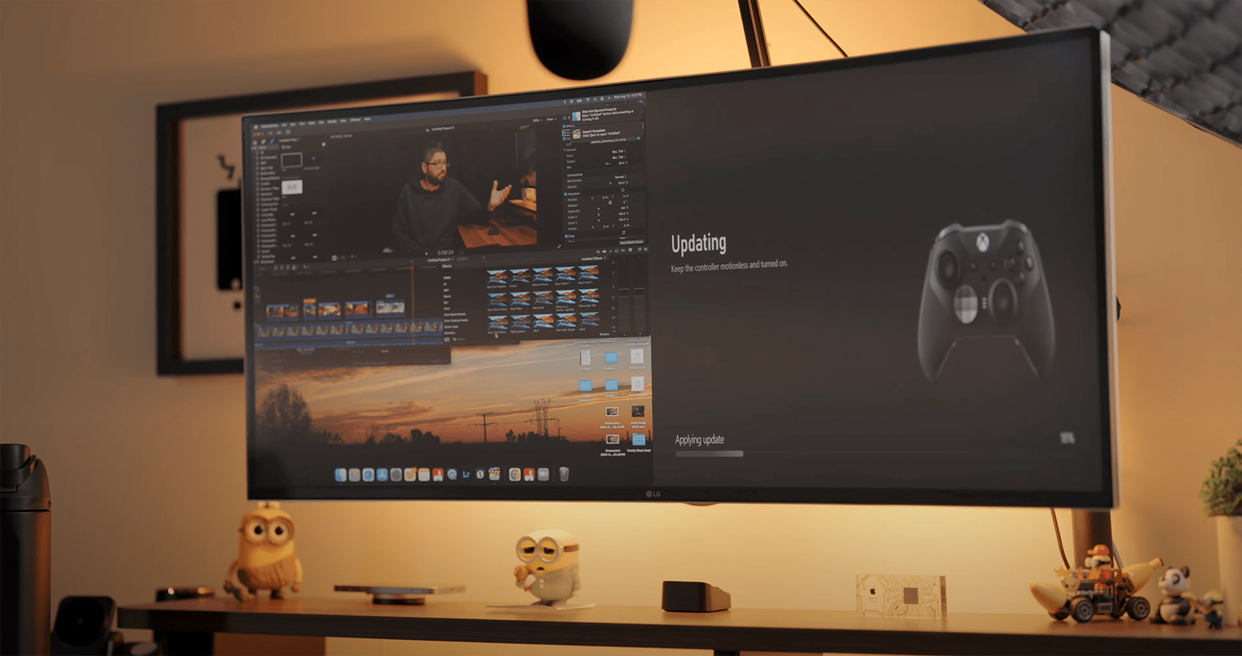 A home office setup with an LG 38WN95C-W monitor displaying video editing software and an Xbox Elite controller update in progress