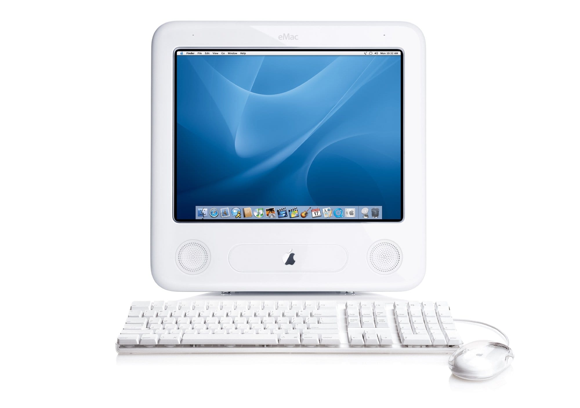 An Apple eMac G4 computer with a clear, white keyboard and a translucent Apple Pro Mouse, displaying the macOS desktop interface on its screen