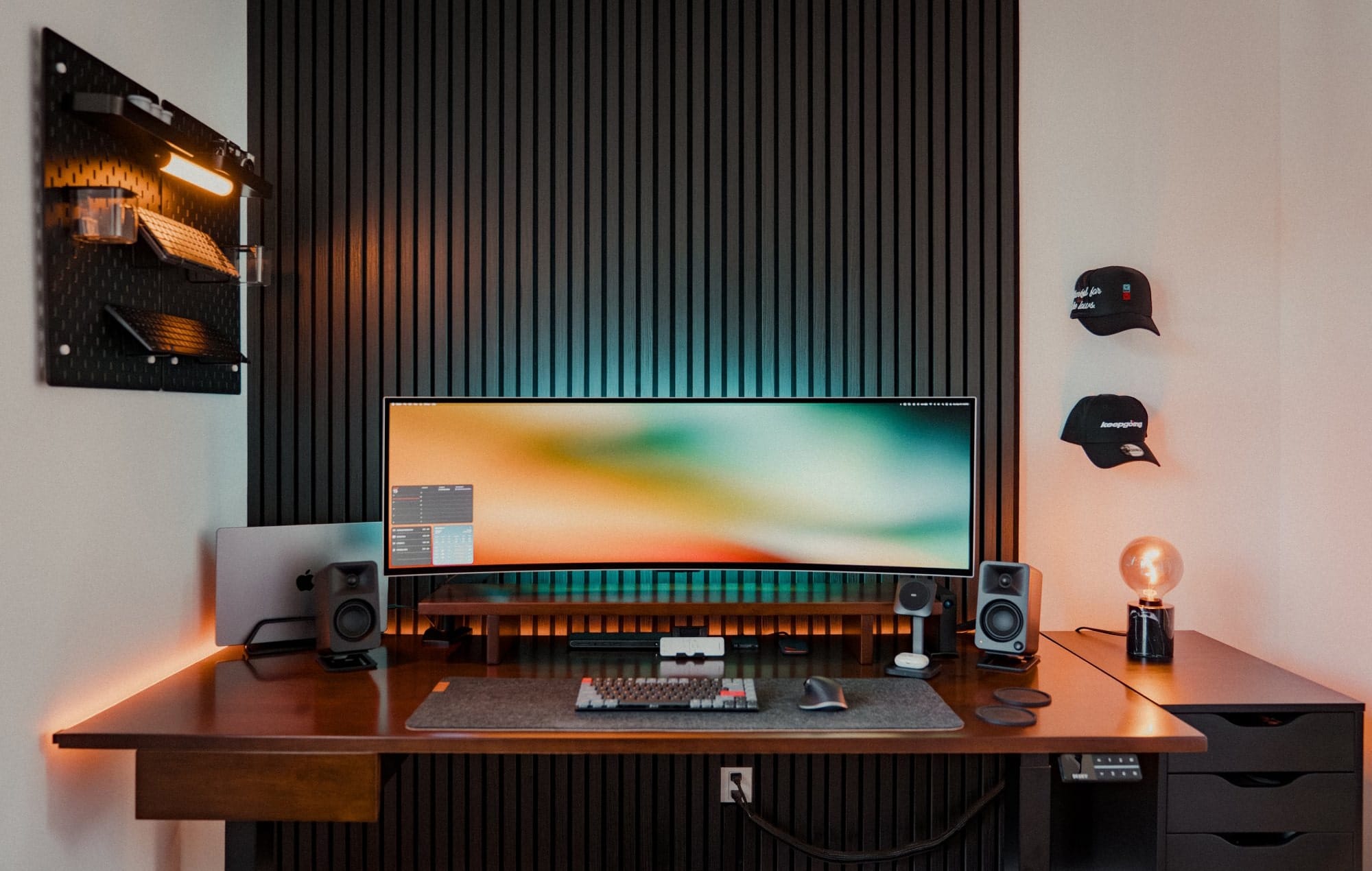 A home office setup with a Samsung 49″ Odyssey OLED G9 monitor