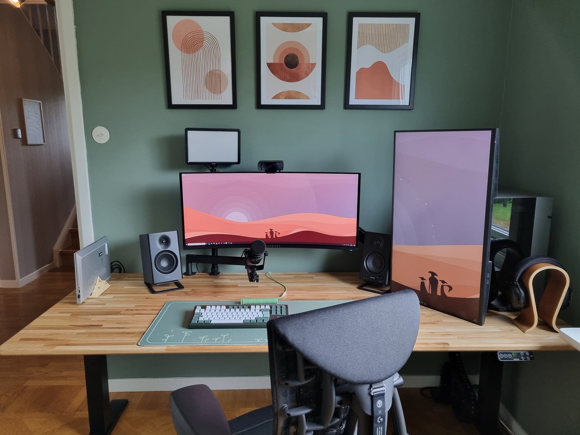 A home office setup with an Alienware AW34DWF monitor, Dell P3223QE monitor in vertical orientation, Edifier MR4 speakers, a Mode Loop TKL keyboard, a Maono PD400X microphone, and a Herman Miller Embody chair