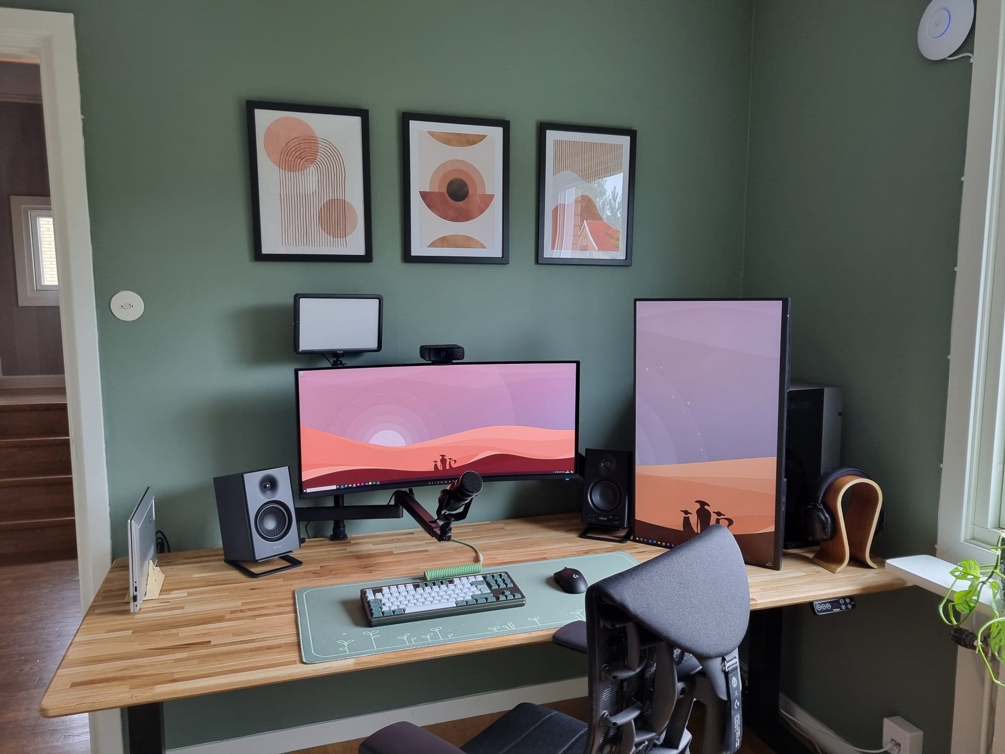 A desk setup with an Alienware AW34DWF monitor, Edifier MR4 speakers, a Maono PD400X microphone, and a Dell P3223QE monitor in vertical orientation