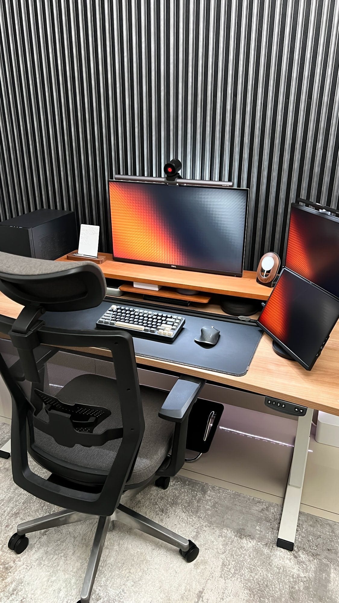 A home office setup with a Dell monitor equipped with a BenQ Screenbar Halo, an Elec Fox Inky 75 keyboard, a Logitech MX Master 3 mouse on an Orbitkey desk mat, and a JSAUX FlipGo dual-screen portable monitor on a Lone Birch desk shelf, all arranged on a Tyyli standing desk with a Reforma acoustic panel wall and a mesh office chair