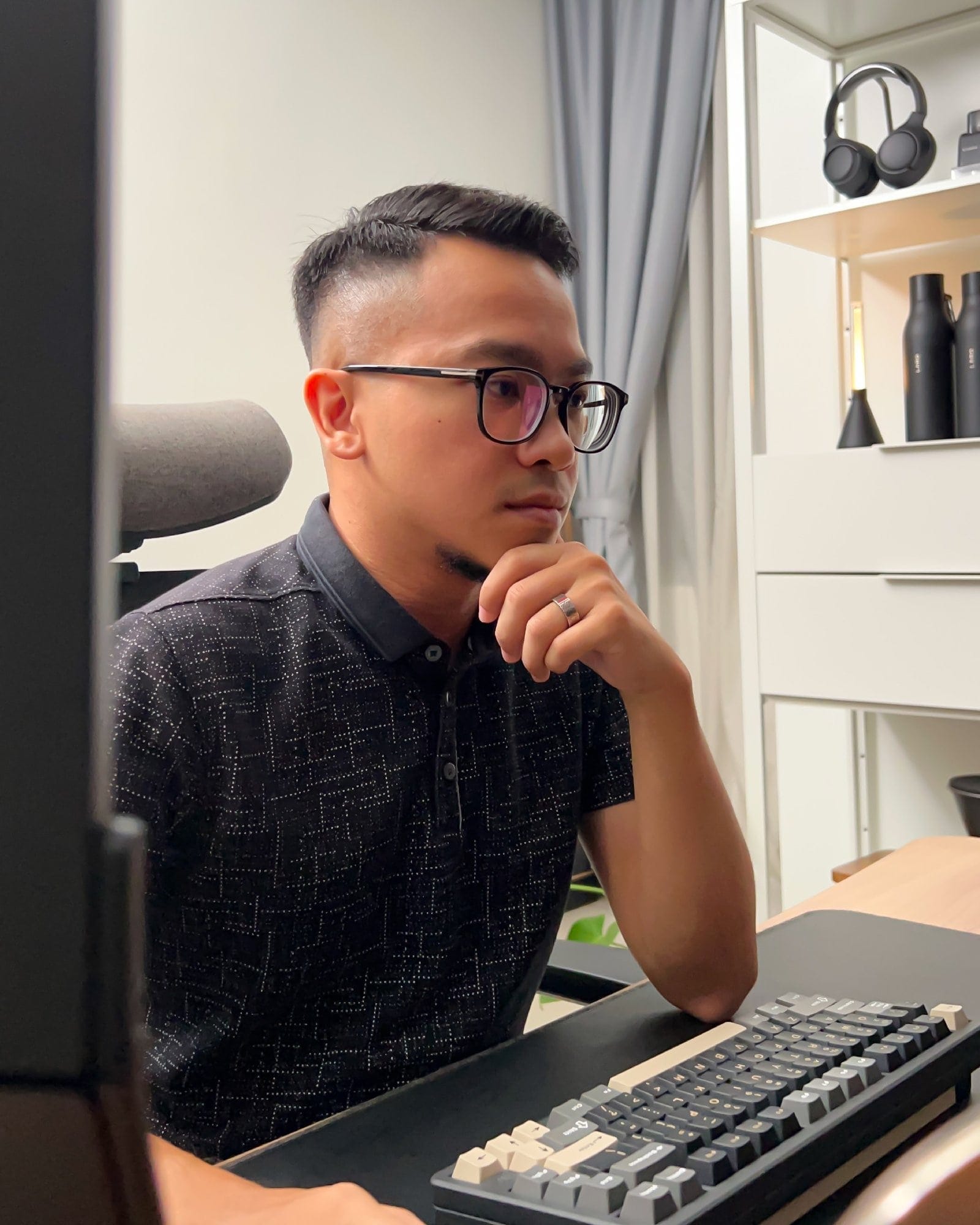 A photo portrait of Rosdi Annuar, a project accountant, working from his home office in Selangor, Malaysia