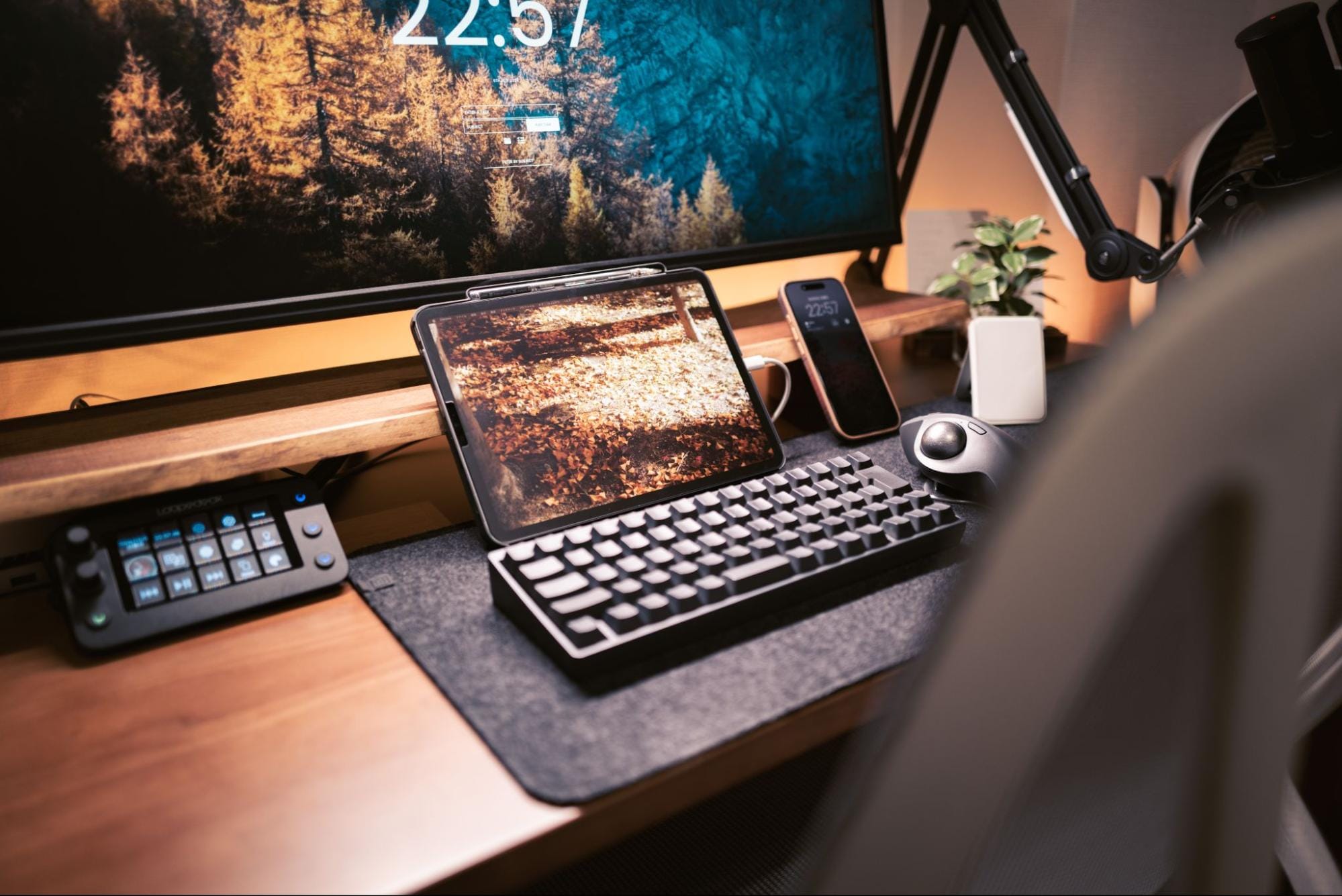 A moody, rustic home office desk setup