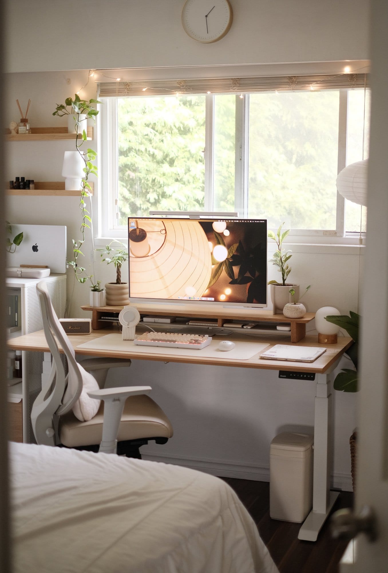 Cosy Bedroom Desk Setup with Plants in Canada