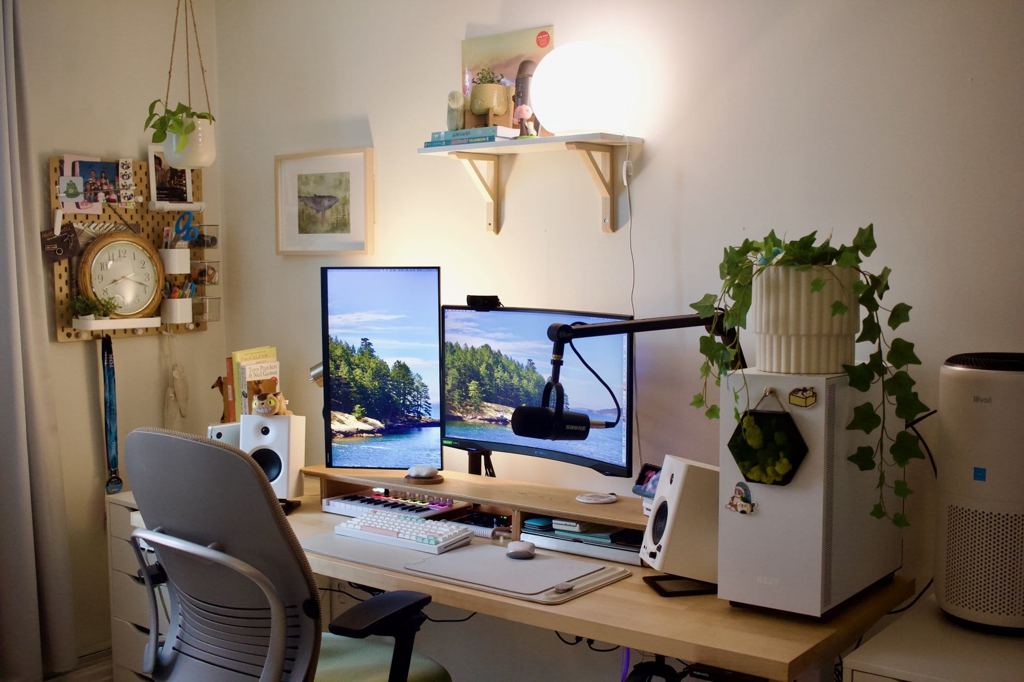 A home office setup with a Samsung Odyssey G5 main monitor, a Samsung 24″ FHD vertical monitor, a Shure MV7 microphone on a Blue Compass Boom Arm, Edifier MR4 speakers, a Steelcase Leap V2 chair, and a custom PC