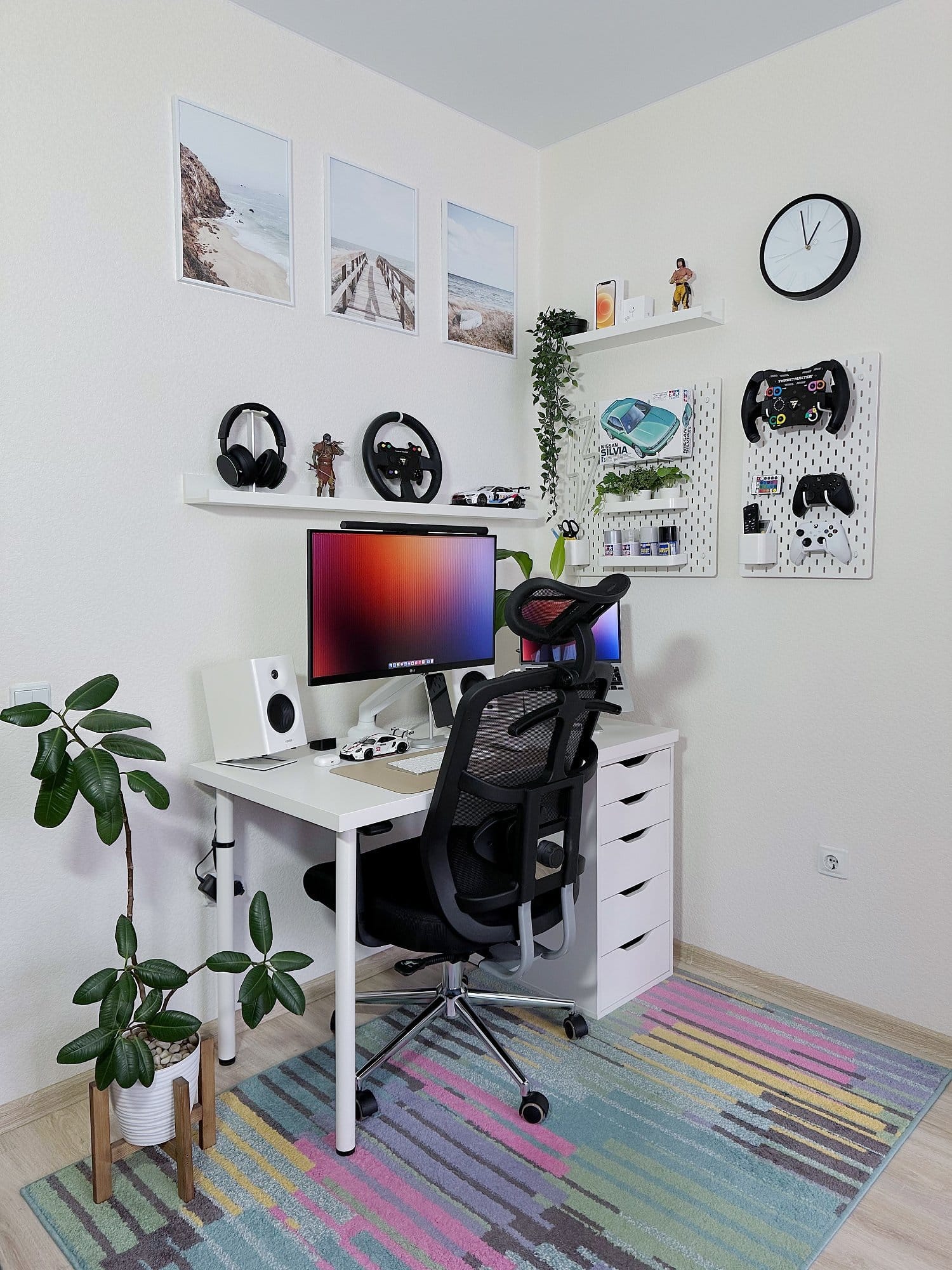 A desk setup with an LG 27UL650-W monitor on an ONKRON G80 mount, a MacBook Air M1 2020 on an aluminium stand, Edifier MR4 speakers, and a TetChair MESH-6 chair on a colourful rug