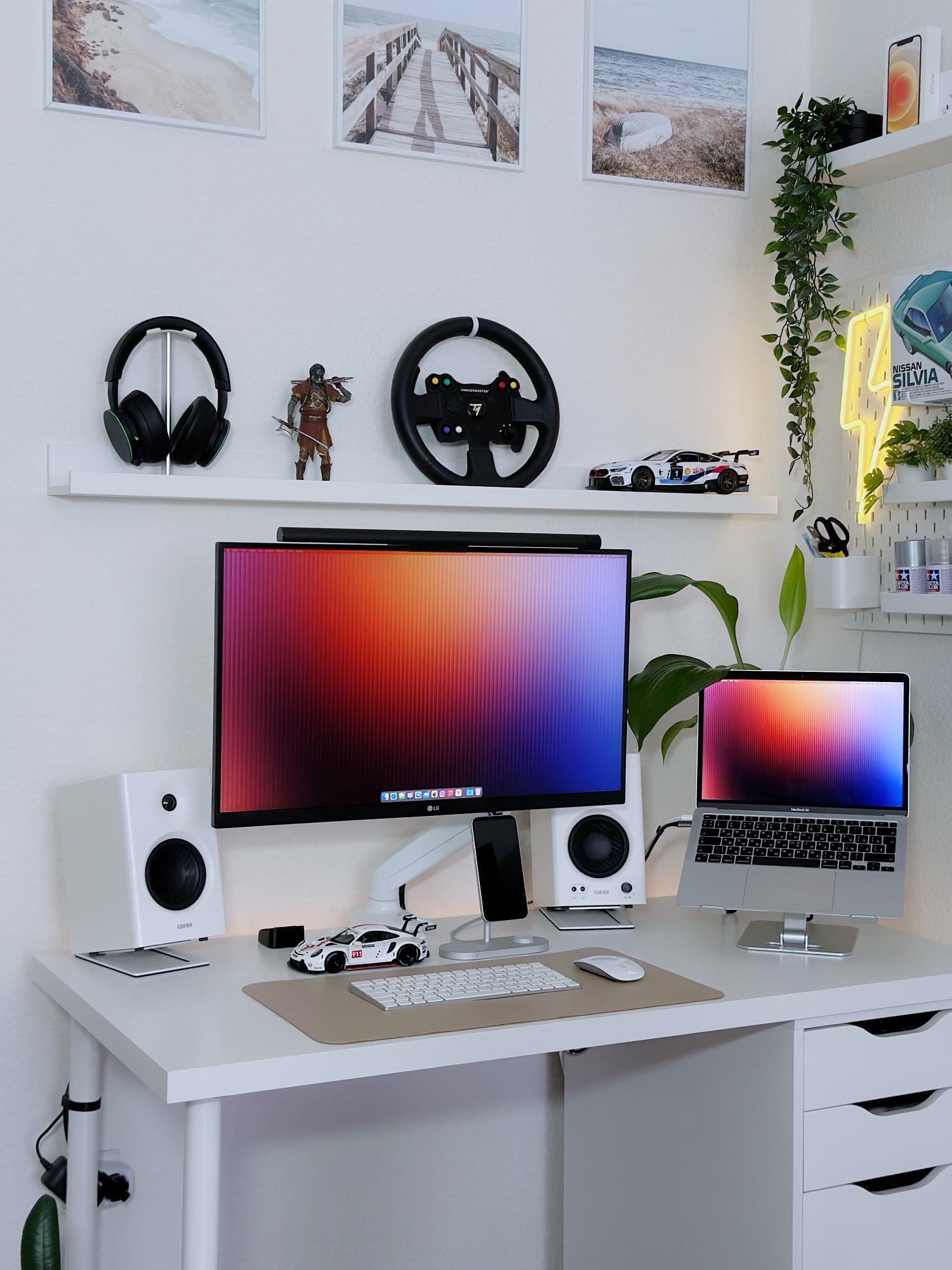 A workspace setup with an LG 27UL650-W monitor, a MacBook Air M1 2020, Edifier MR4 speakers, and an Apple Magic Keyboard 2 on a Humanmotion desk mat