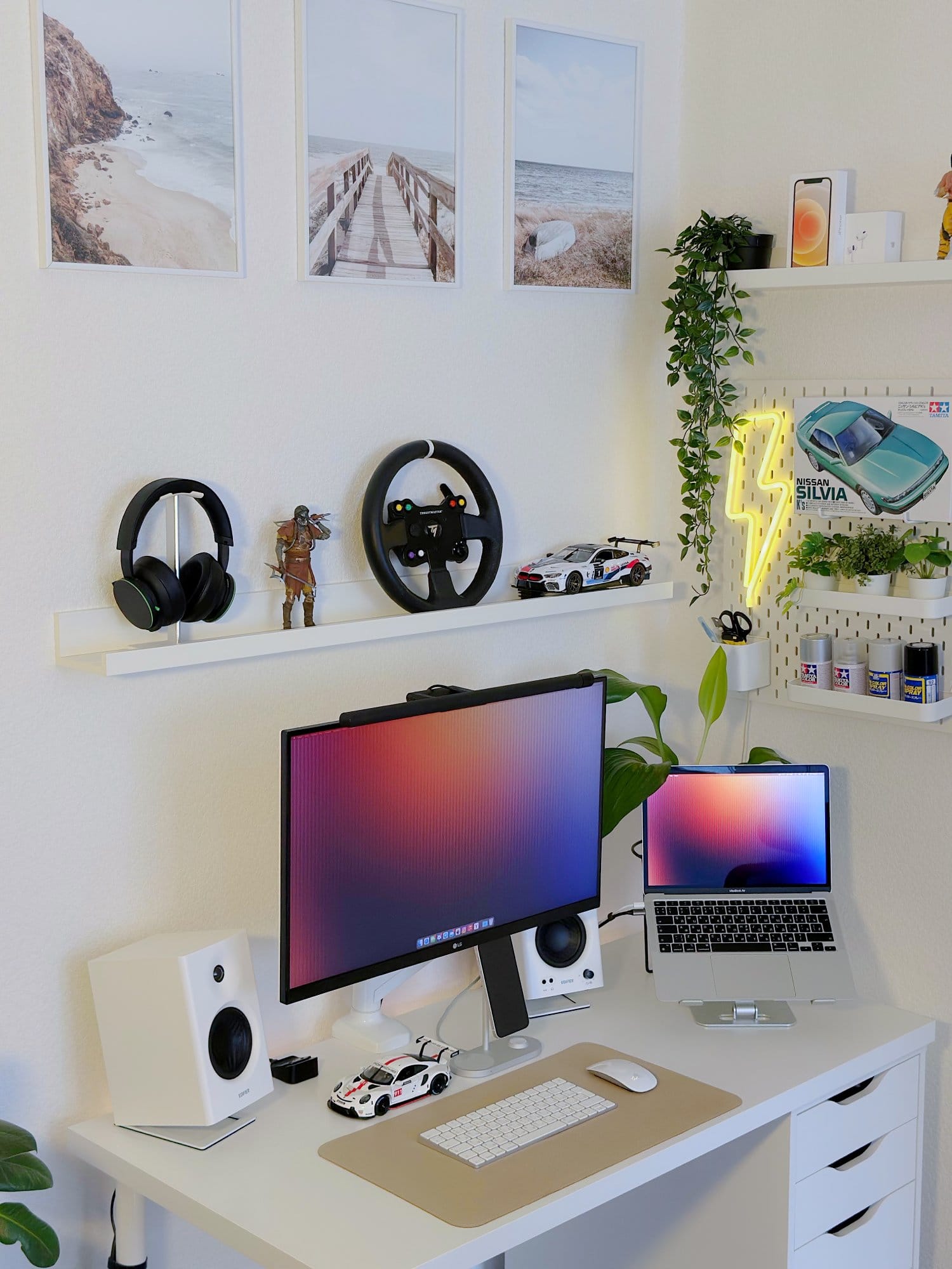 A minimal corner setup with an LG 27UL650-W monitor on an ONKRON G80 mount, a MacBook Air M1 2020 on an aluminium stand, Edifier MR4 speakers, and a car model on the desk